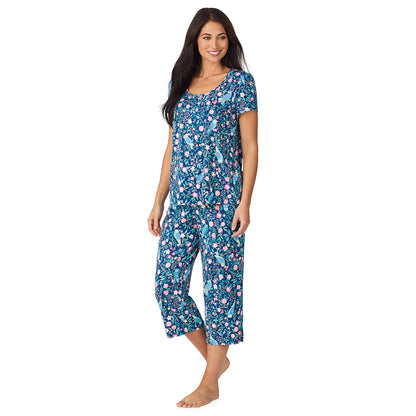 A lady wearing Cotton-Blend Short Sleeve Top with Cropped Pant with Scallop Detail 2-Pc Pajama Set in Dark Blue Owl