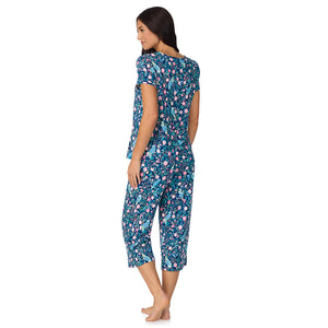 A lady wearing Cotton-Blend Short Sleeve Top with Cropped Pant with Scallop Detail 2-Pc Pajama Set in Dark Blue Owl