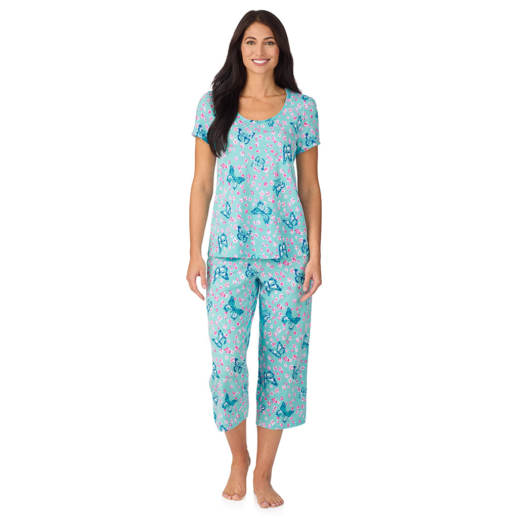A lady wearing Cotton-Blend Short Sleeve Top with Cropped Pant with Scallop Detail 2-Pc Pajama Set in Aqua Butterfly