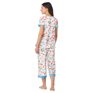  A lady wearing Cotton-Blend Short Sleeve Top and Cropped Pant Pajama Set in Summer Landscape posing back view pose
