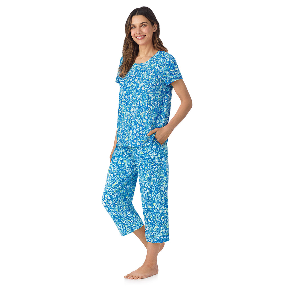 A lady wearing Cotton-Blend Short Sleeve Top and Cropped Pant Pajama Set in Blue Ditsy posing side angle view pose