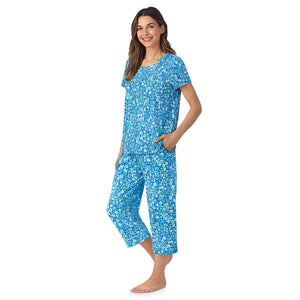  A lady wearing Cotton-Blend Short Sleeve Top and Cropped Pant Pajama Set in Blue Ditsy posing side angle view pose