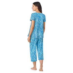  A lady wearing Cotton-Blend Short Sleeve Top and Cropped Pant Pajama Set in Blue Ditsy posing back view pose