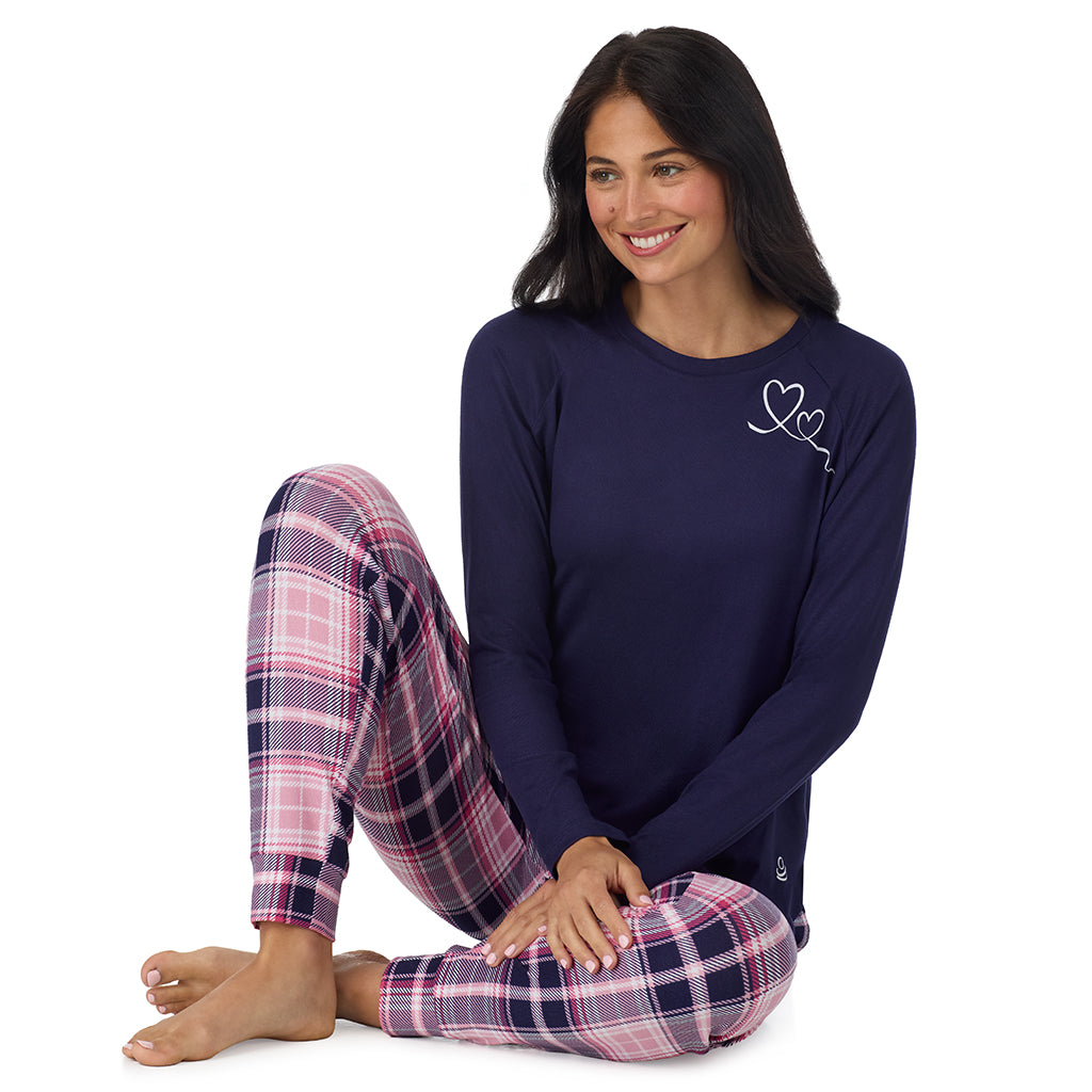 Heart Pink Plaid; Model is wearing size S. She is 5'8.5", Bust 32", Waist 25", Hips 36". @ A lady wearing Heart Pink Plaid Brushed Sweater Knit Long Sleeve Jogger Pajama Set in a front view sitting pose