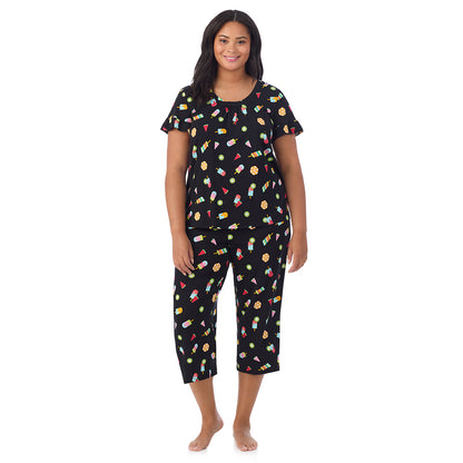 A lady wearing Cotton-Blend Ruffle Short Sleeve Top and Cropped Pants Pajama Set in Icepop print