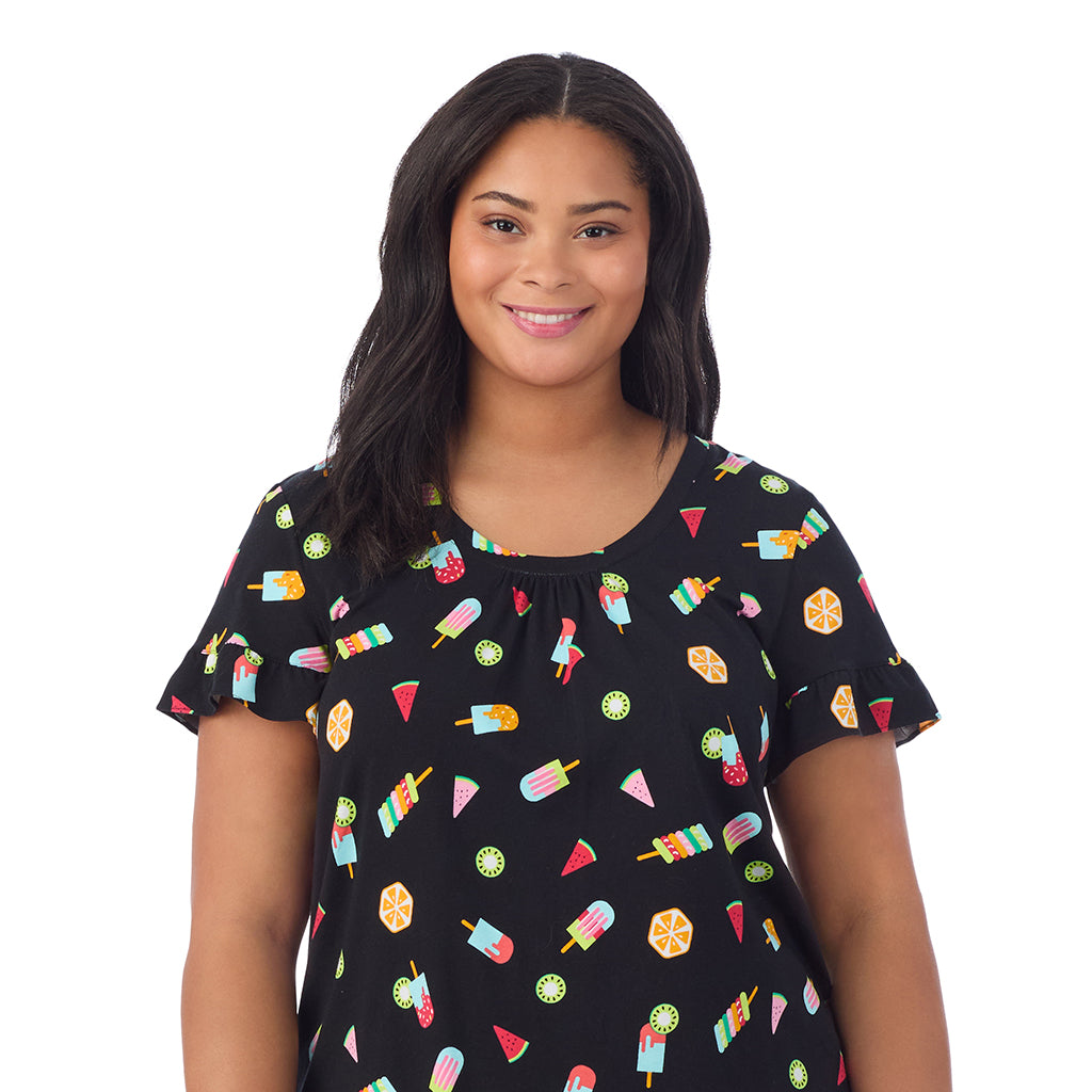 A lady wearing Cotton-Blend Ruffle Short Sleeve Top and Cropped Pants Pajama Set in Icepop print