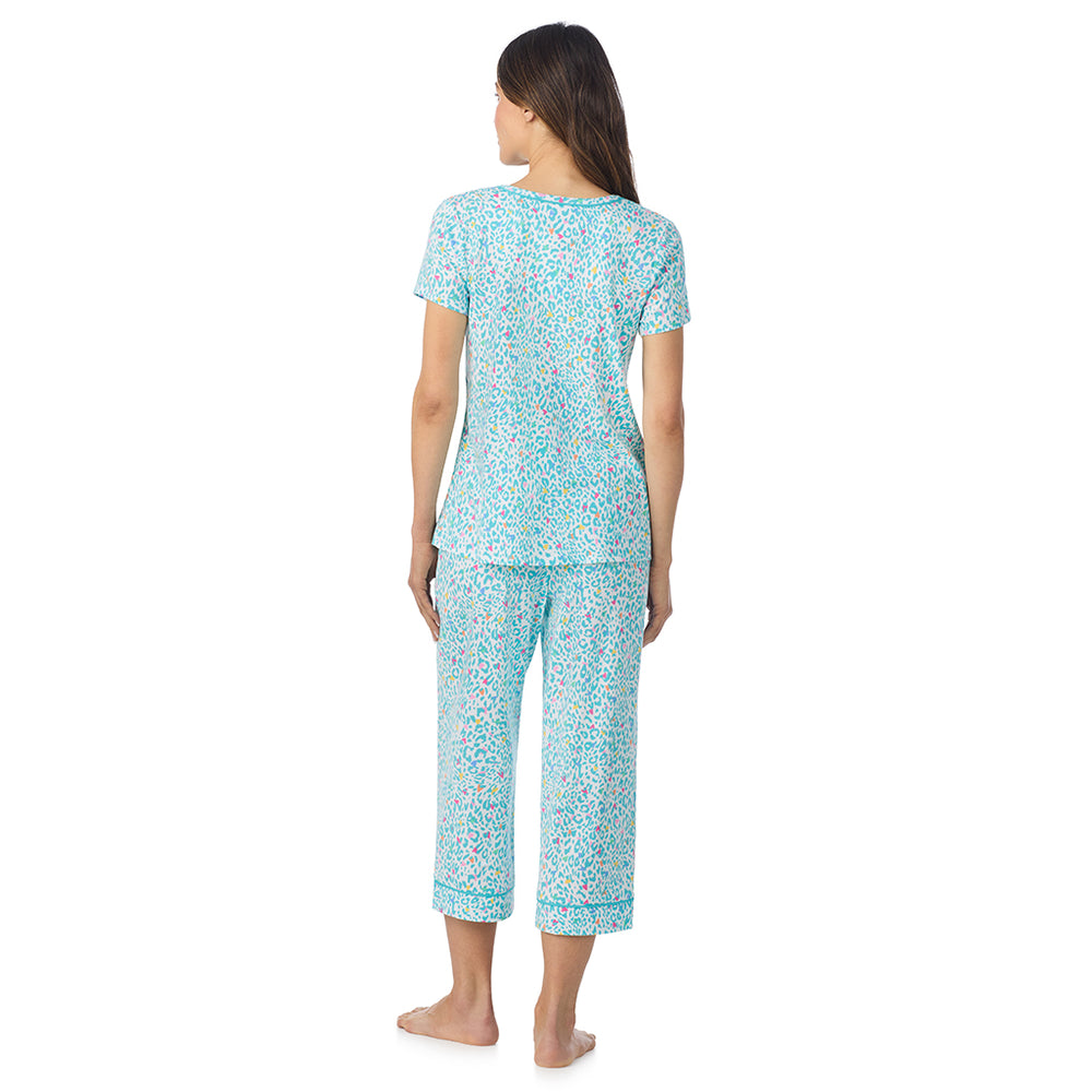 A lady wearing Cotton-Blend Short Sleeve Top and Cropped Pant Pajama Set in Teal Heart Animal posing back view pose