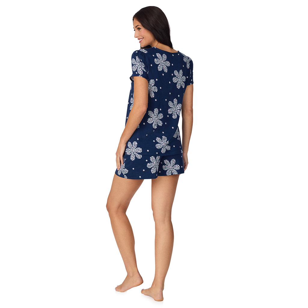 Navy Flower Print; Model is wearing size S. She is 5'8.5", Bust 32", Waist 25", Hips 36". @A lady wearing Cotton-Blend Short Sleeve Top with Short Pajama Set in Navy Flower Print