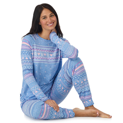  A lady wearing Peri Blue Heart Fairisle Brushed Sweater Knit Long Sleeve Jogger Pajama Set in a front view sitting pose
