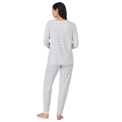  A lady wearing White + Grey Stripe Brushed Sweater Knit Long Sleeve Jogger Pajama Set in a back view pose