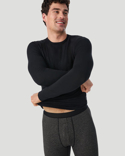  A man wearing Grey Stripe FlexStripe Pant shown in a front view pose while lifting his T-shirt slightly