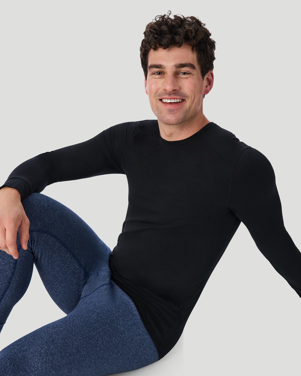 Navy Stripe; Model is wearing a size M. He is 6’2”, Waist is 32”, Inseam 32”.  @ A man wearing Navy Stripe FlexStripe Pant in a front view sitting pose
