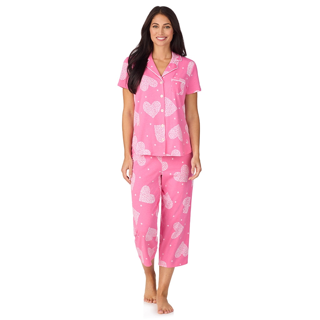 A lady wearing Cotton-Blend Short Sleeve Notch Collar with Cropped Pant 2-Pc Pajama Set in Pink Flower Heart