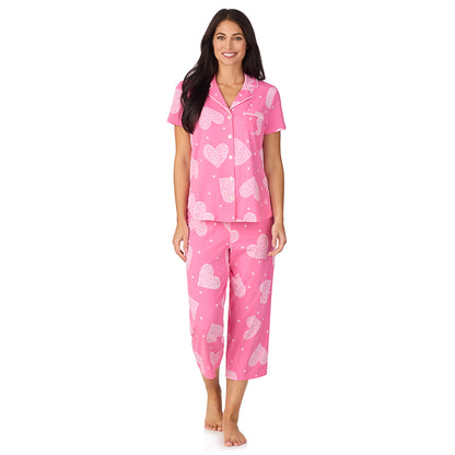 A lady wearing Cotton-Blend Short Sleeve Notch Collar with Cropped Pant 2-Pc Pajama Set in Pink Flower Heart