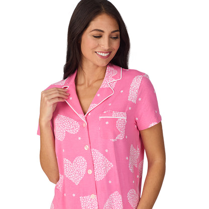 A lady wearing Cotton-Blend Short Sleeve Notch Collar with Cropped Pant 2-Pc Pajama Set in Pink Flower Heart