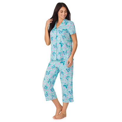A lady wearing Cotton-Blend Short Sleeve Notch Collar with Cropped Pant 2-Pc Pajama Set in Aqua Butterfly