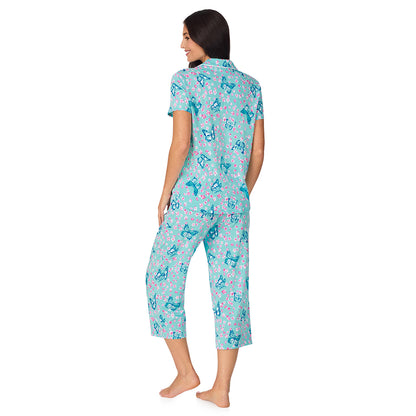 A lady wearing Cotton-Blend Short Sleeve Notch Collar with Cropped Pant 2-Pc Pajama Set in Aqua Butterfly