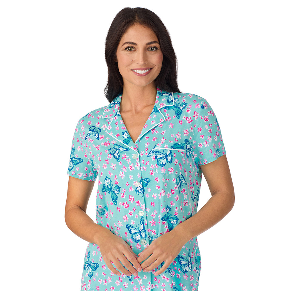 A lady wearing Cotton-Blend Short Sleeve Notch Collar with Cropped Pant 2-Pc Pajama Set in Aqua Butterfly
