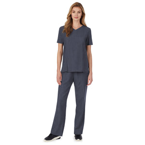 A lady wearing Navy Heather short sleeve scrub v-neck top with chest pocket.