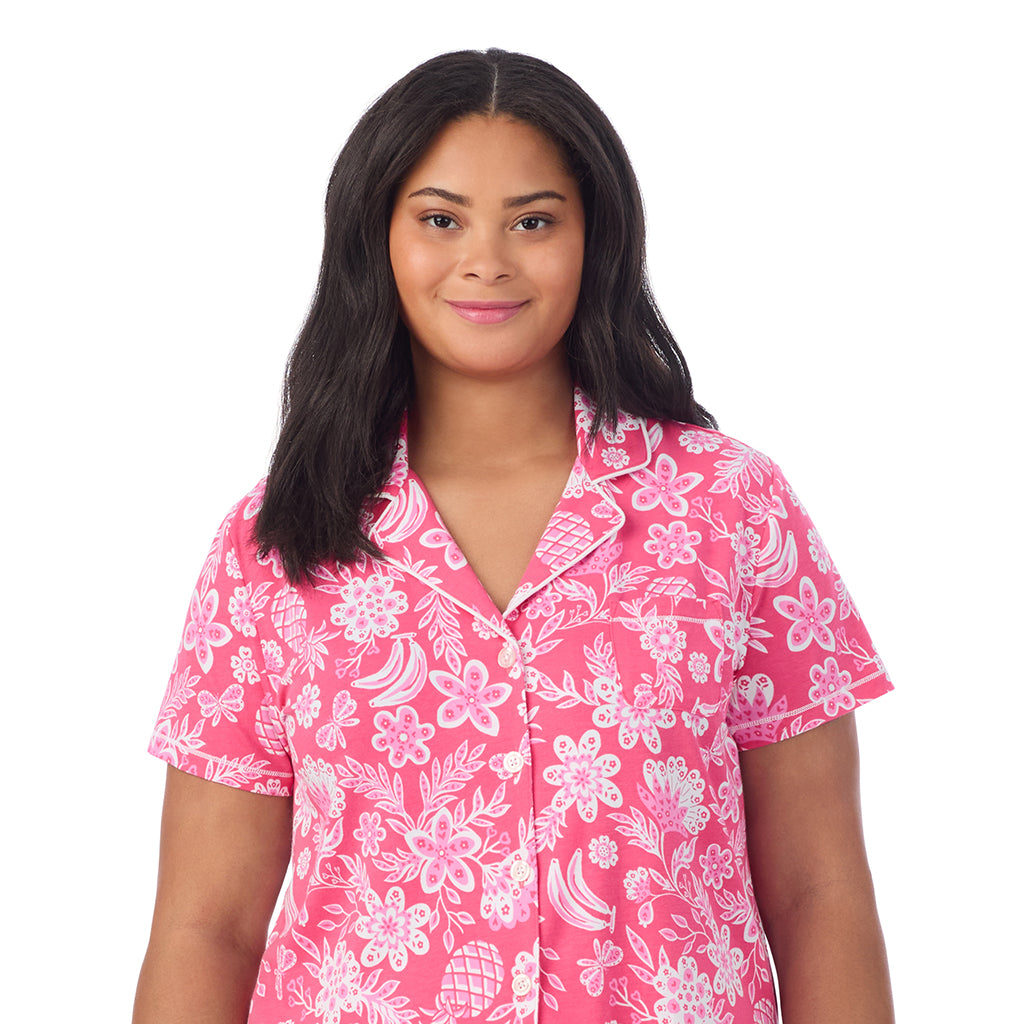 A lady wearing Cotton-Blend Short Sleeve Notch Collar with Cropped Pant Pajama Set in pink tropical print