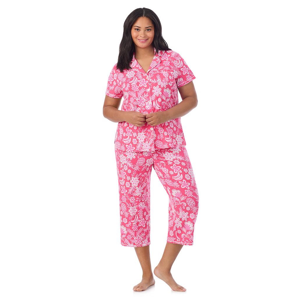 A lady wearing Cotton-Blend Short Sleeve Notch Collar with Cropped Pant Pajama Set in pink tropical print
