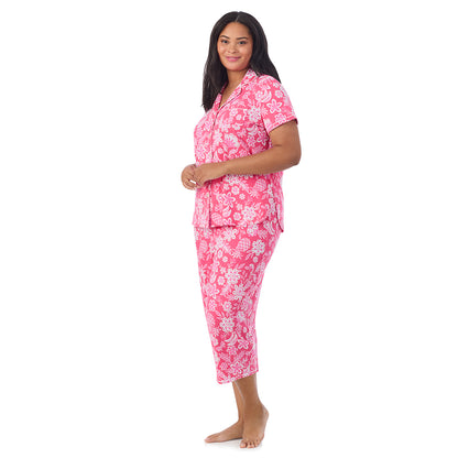 A lady wearing Cotton-Blend Short Sleeve Notch Collar with Cropped Pant Pajama Set in pink tropical print