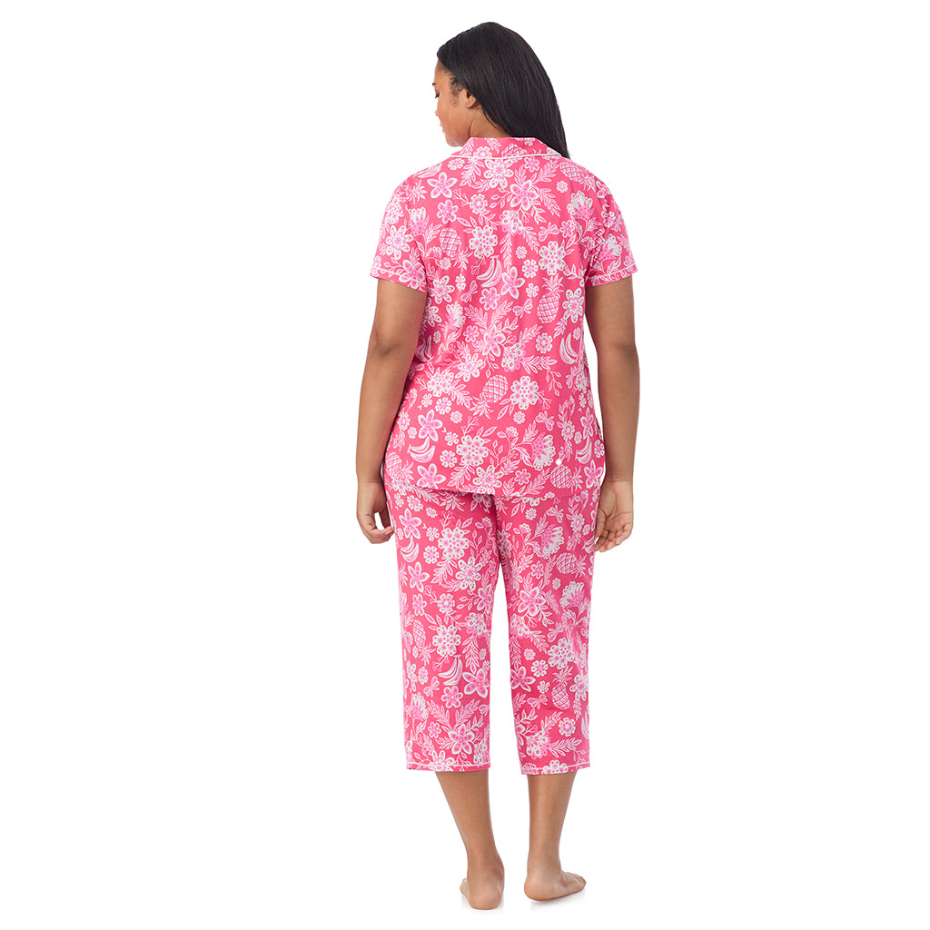 A lady wearing Cotton-Blend Short Sleeve Notch Collar with Cropped Pant Pajama Set in pink tropical print