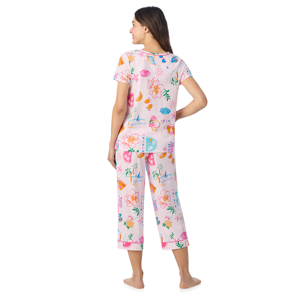 A lady wearing Cotton-Blend Short Sleeve Top and Cropped Pant Pajama Set in Pink Summer Scene posing back view pose
