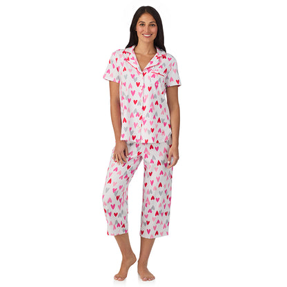 A lady wearing Cotton Rich Short Sleeve Notch Collar Top with Cropped Pant Pajama Set