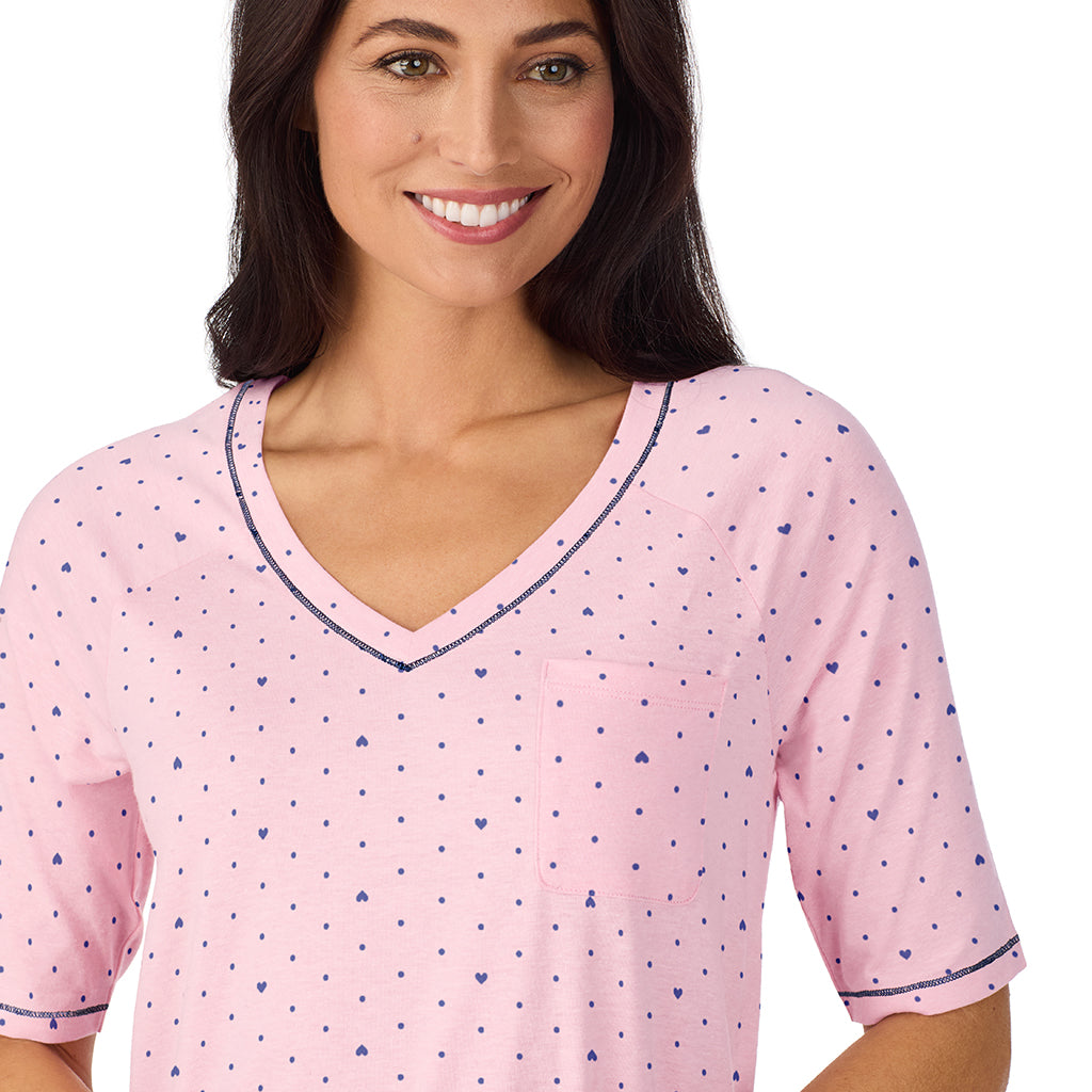 Pink Bow;Model is wearing size S. She is 5'8.5", Bust 32", Waist 25", Hips 36".
@ A lady wearing Cuddl Smart Elbow Sleeve Sleep Tee with Pink bow print