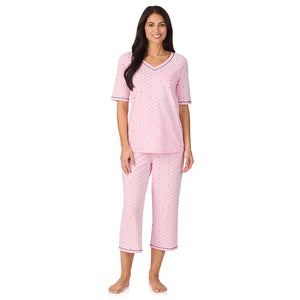  A lady wearing Cuddl Smart Elbow Sleeve Top with Cropped Pant Pajama Set with Pink Bow print
