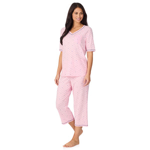  A lady wearing Cuddl Smart Elbow Sleeve Top with Cropped Pant Pajama Set with Pink Bow print