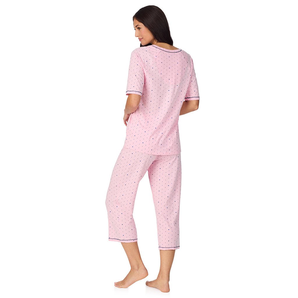  A lady wearing Cuddl Smart Elbow Sleeve Top with Cropped Pant Pajama Set with Pink Bow print
