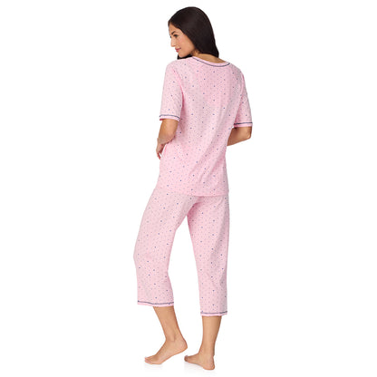  A lady wearing Cuddl Smart Elbow Sleeve Top with Cropped Pant Pajama Set with Pink Bow print