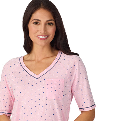  A lady wearing Cuddl Smart Elbow Sleeve Top with Cropped Pant Pajama Set with Pink Bow print