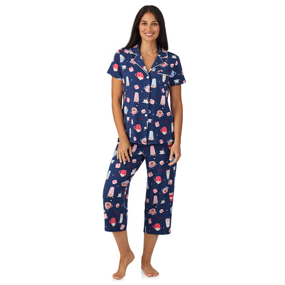 A lady wearing Cotton Rich Short Sleeve Notch Collar Top with Cropped Pant Pajama Set