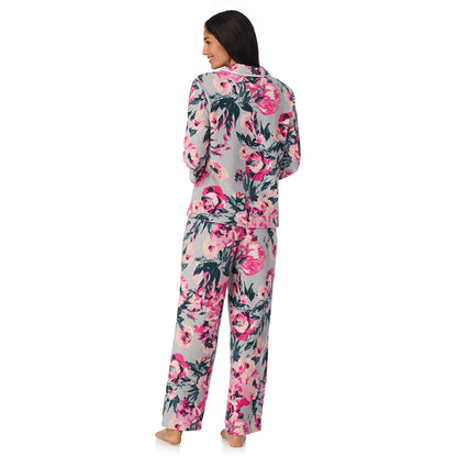 A lady wearing Cuddl Duds x Jennifer Lake Fleece with Stretch Long Sleeve Notch Collar Top with Pant Pajamas