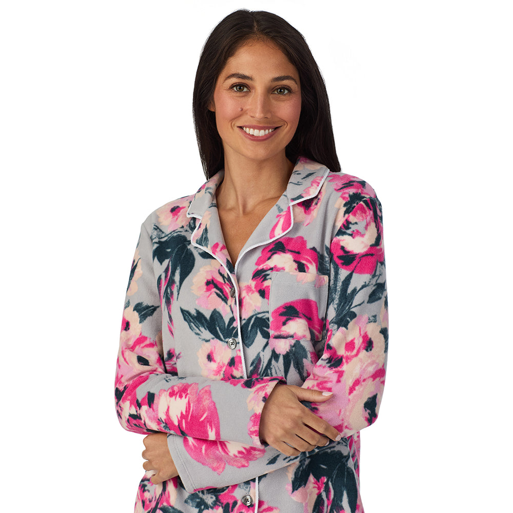 A lady wearing Cuddl Duds x Jennifer Lake Fleece with Stretch Long Sleeve Notch Collar Top with Pant Pajamas