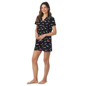  A lady wearing Cotton-Blend Short Sleeve Notch Collar with Short 2-Pc Pajama Set in Black Sunglasses posing side angle view pose