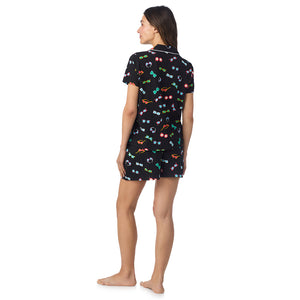  A lady wearing Cotton-Blend Short Sleeve Notch Collar with Short 2-Pc Pajama Set in Black Sunglasses posing back view pose