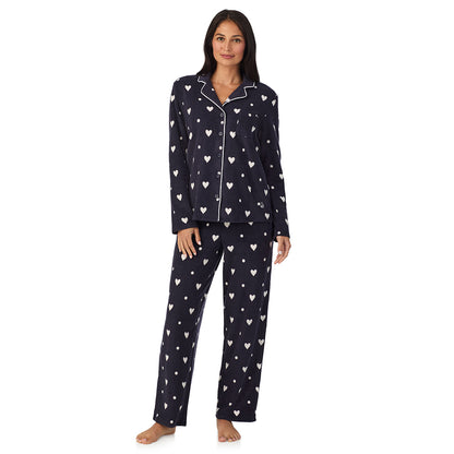 A lady wearing Cuddl Duds x Jennifer Lake Fleece with Stretch Long Sleeve Notch Collar Top with Pant Pajamas
