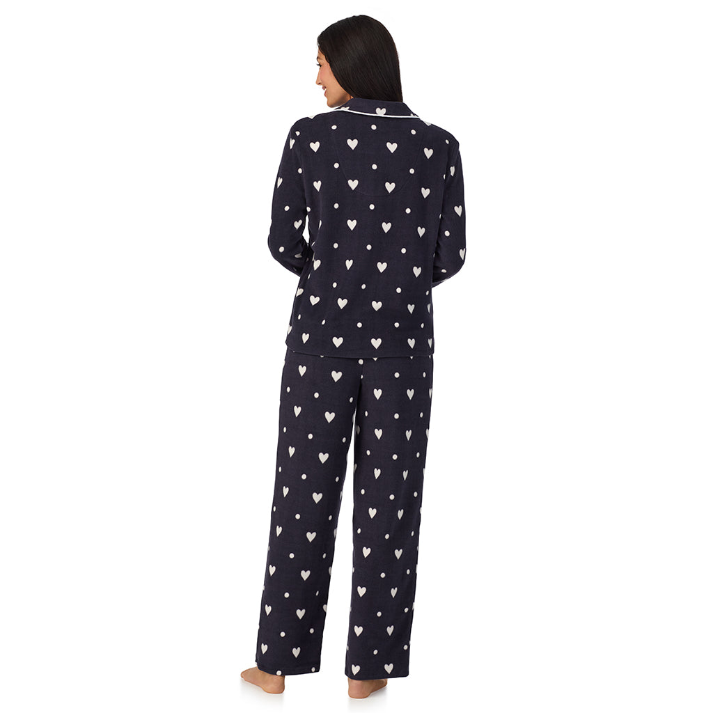 Navy Heart Ditsy;Model is wearing size S. She is 5'8.5", Bust 32", Waist 25", Hips 36".@A lady wearing Cuddl Duds x Jennifer Lake Fleece with Stretch Long Sleeve Notch Collar Top with Pant Pajamas