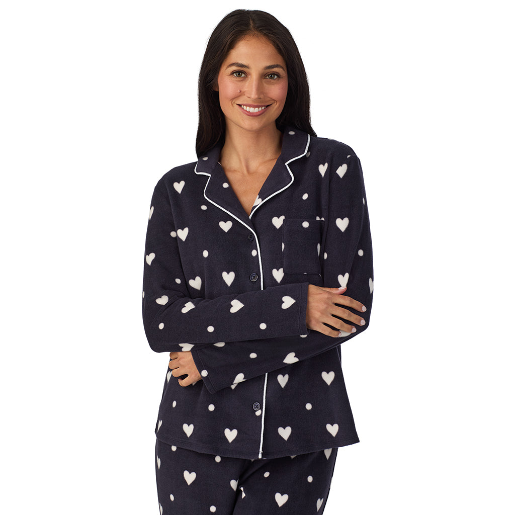 Navy Heart Ditsy;Model is wearing size S. She is 5'8.5", Bust 32", Waist 25", Hips 36".@A lady wearing Cuddl Duds x Jennifer Lake Fleece with Stretch Long Sleeve Notch Collar Top with Pant Pajamas