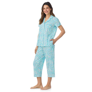 A lady wearing Cotton-Blend Short Sleeve Notch Collar with Cropped Pant Pajama Set in Teal Heart Animal posing side angle view pose