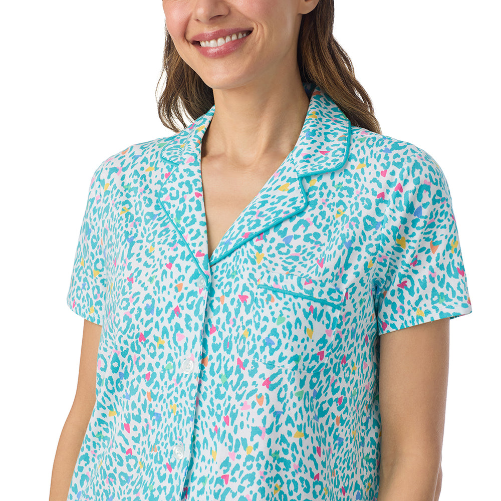 A lady wearing Cotton-Blend Short Sleeve Notch Collar with Cropped Pant Pajama Set in Teal Heart Animal posing close up view pose