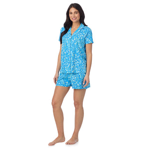  A lady wearing Cotton-Blend Short Sleeve Notch Collar with Short 2-Pc Pajama Set in Blue Ditsy posing side angle view pose