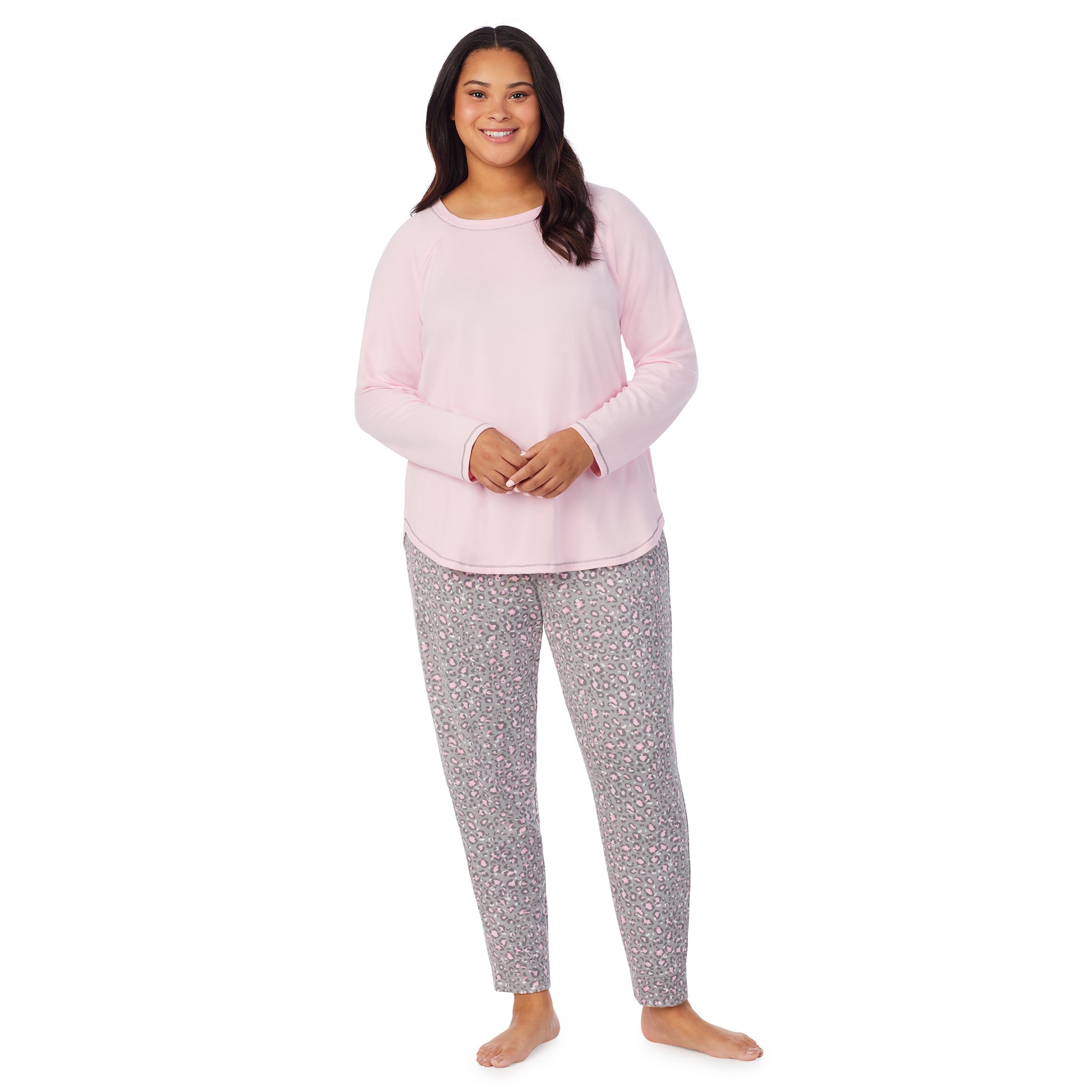 A lady wearing animal with pink brushed sweater knit long sleeve plus pajama set. 