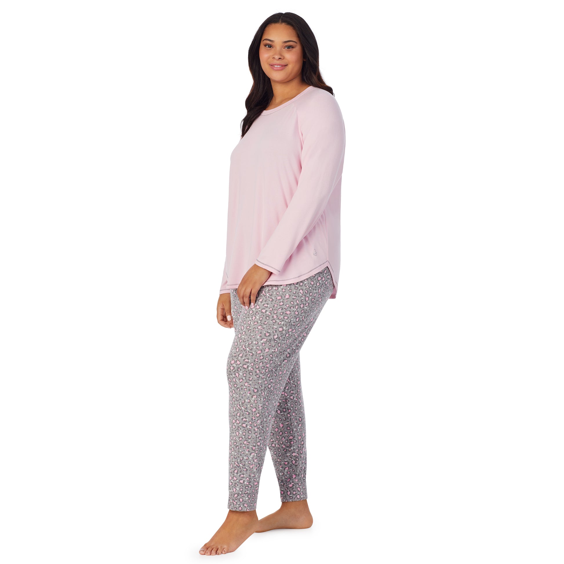 A lady wearing animal with pink brushed sweater knit long sleeve plus pajama set. 