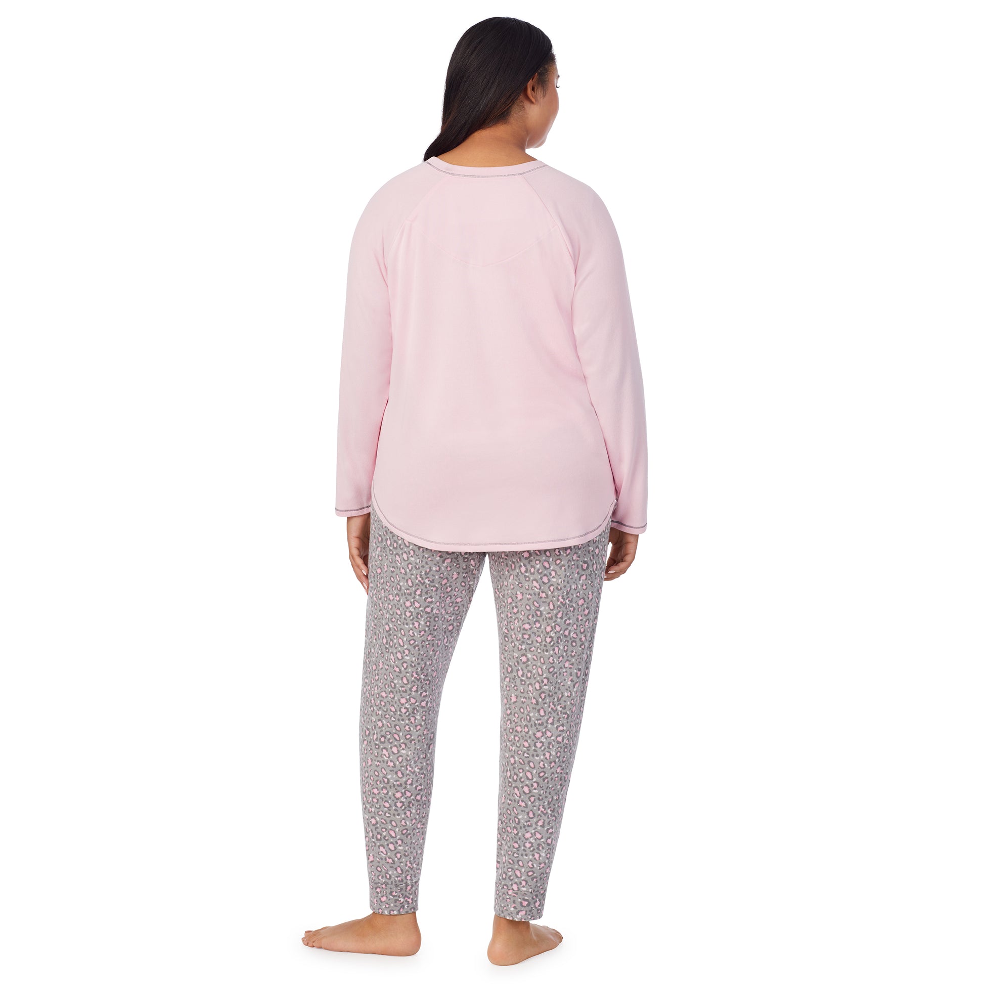 A lady wearing animal with pink brushed sweater knit long sleeve plus pajama set. 