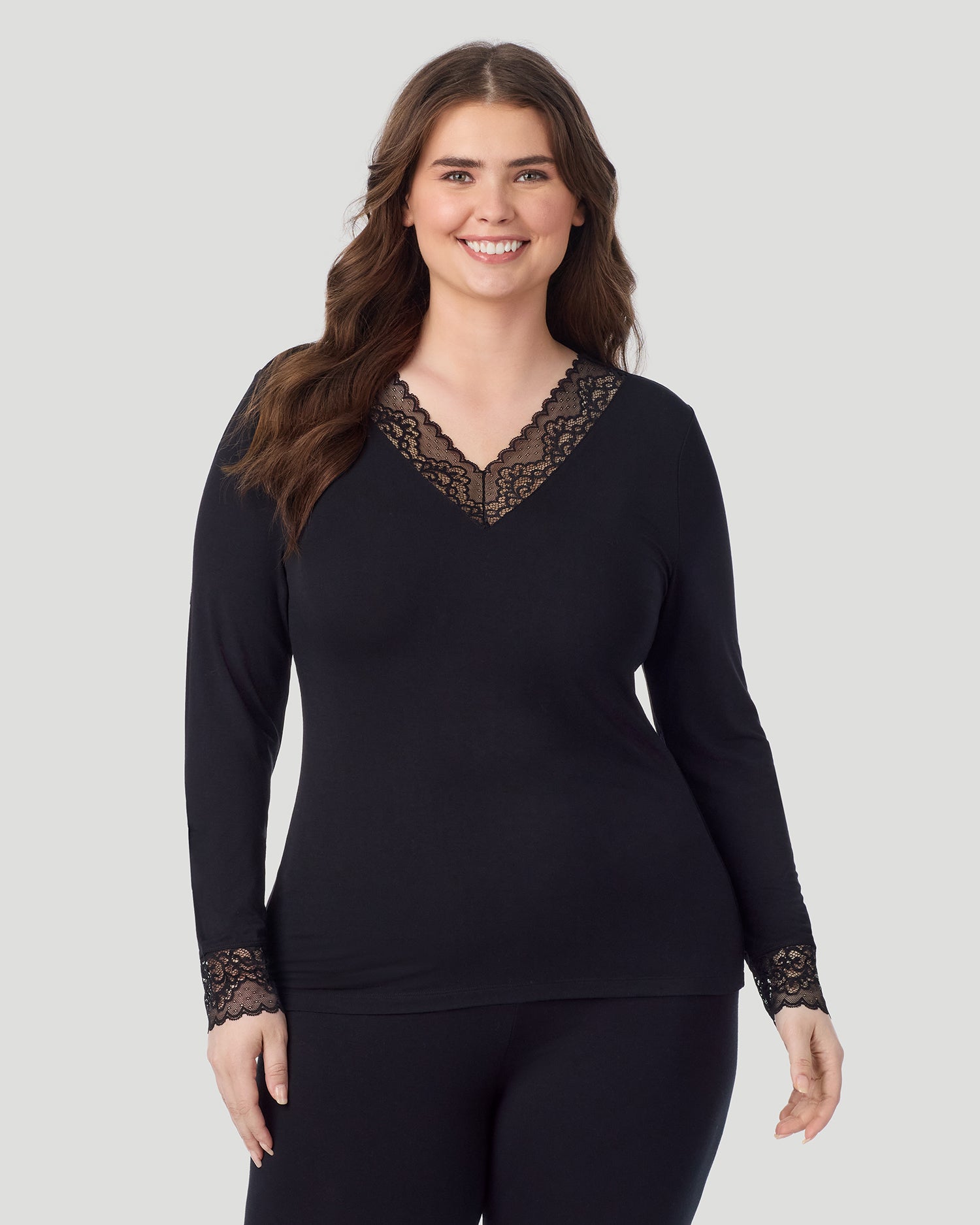 Black; Model is wearing size 1X. She is 5'10", Bust 44", Waist 36", Hips 49". @A plus size lady wearing black Softwear With Stretch Long Sleeve V-Neck With Lace PLUS in a front view pose